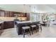 Modern kitchen with island, stainless steel appliances, and dark wood cabinets at 2008 Galapago, Denver, CO 80223