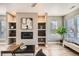 Open living room featuring a built-in fireplace and hardwood floors at 2008 Galapago, Denver, CO 80223