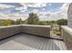 Spacious rooftop deck with brick walls and composite decking, offering city views at 2008 Galapago, Denver, CO 80223