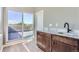 Wet bar with a dark wood cabinet, marble countertop and access to a deck at 2008 Galapago, Denver, CO 80223