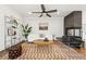 Cozy living room featuring a stylish rug, modern furniture, and ample natural light at 3941 Vallejo St, Denver, CO 80211