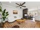 Bright living room featuring modern decor, a fireplace, and stylish furnishings at 3941 Vallejo St, Denver, CO 80211