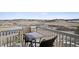 Outdoor dining set on a balcony with a scenic view of rolling hills at 3197 Cool Meadow Pl, Castle Rock, CO 80104