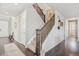 Inviting entryway with hardwood floors, staircase, and stylish decor that leads to upper levels of the home at 3197 Cool Meadow Pl, Castle Rock, CO 80104