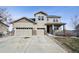 Charming two-story home with a three-car garage and inviting front porch, perfect for Gathering living at 3197 Cool Meadow Pl, Castle Rock, CO 80104