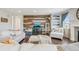 Cozy living room with stylish decor, hardwood floors, and a rustic wood accent wall at 3197 Cool Meadow Pl, Castle Rock, CO 80104