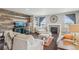 Comfortable living room with a fireplace, hardwood floors, and a rustic accent wall at 3197 Cool Meadow Pl, Castle Rock, CO 80104