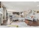 Spacious open-concept living room flowing into the kitchen, with hardwood floors and neutral decor at 3197 Cool Meadow Pl, Castle Rock, CO 80104