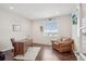 Cozy office space featuring a wooden desk, comfortable armchair, and a bright window offering neighborhood views at 3197 Cool Meadow Pl, Castle Rock, CO 80104