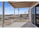 A covered patio with stone pavers, offering a peaceful view of the natural landscape at 3197 Cool Meadow Pl, Castle Rock, CO 80104