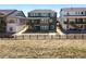 The back exterior features a staircase and balcony, adding architectural interest and outdoor enjoyment at 3399 Backdrop Ct, Castle Rock, CO 80108