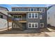 The back exterior features a staircase and balcony, adding architectural interest and outdoor enjoyment at 3399 Backdrop Ct, Castle Rock, CO 80108