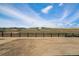 View of the backyard showing natural landscape and wooden fence, promoting outdoor living and privacy at 3399 Backdrop Ct, Castle Rock, CO 80108