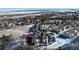 Scenic aerial view of townhomes nestled in a snowy landscape, offering a serene and picturesque neighborhood setting at 6980 Fargo Trl, Littleton, CO 80125