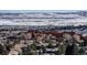 Aerial view of homes nestled amongst red rocks and snow at 6980 Fargo Trl, Littleton, CO 80125