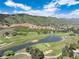 Gorgeous aerial view showcasing golf course, pond and rolling hills at 6980 Fargo Trl, Littleton, CO 80125
