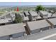 Aerial view of townhome exterior featuring a garage, roof, and front entrance at 6980 Fargo Trl, Littleton, CO 80125