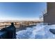 Spacious backyard with mountain views, partially covered deck, and grill at 6980 Fargo Trl, Littleton, CO 80125