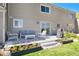 Back patio with outdoor seating, barbeque, and raised garden at 6980 Fargo Trl, Littleton, CO 80125