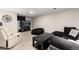 Finished basement with comfortable seating, a large TV, and a relaxing atmosphere at 6980 Fargo Trl, Littleton, CO 80125