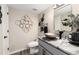 Elegant powder room with a vessel sink, modern fixtures, and stylish decor at 6980 Fargo Trl, Littleton, CO 80125