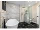 Luxurious bathroom with freestanding tub, glass shower, and modern finishes at 6980 Fargo Trl, Littleton, CO 80125