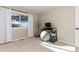 Cozy bedroom with desk, window with views, and light carpet at 6980 Fargo Trl, Littleton, CO 80125