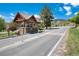 Community entrance with guard house and security features at 6980 Fargo Trl, Littleton, CO 80125
