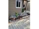Exterior of the home with stylish deck, rock detail, meticulous landscaping, and fresh mulch for a neat appearance at 6980 Fargo Trl, Littleton, CO 80125