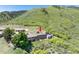 Aerial view of townhome with mountain views in golf course community at 6980 Fargo Trl, Littleton, CO 80125