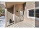 Private entrance and deck with winter scene at 6980 Fargo Trl, Littleton, CO 80125