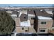 Rear view of townhome showcasing deck and mountain views at 6980 Fargo Trl, Littleton, CO 80125