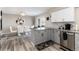 Charming kitchen seamlessly transitions to a bright dining area with outside views at 6980 Fargo Trl, Littleton, CO 80125