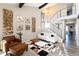 Bright living room with high ceilings, contemporary decor, and open staircase creating an airy and inviting space at 6980 Fargo Trl, Littleton, CO 80125