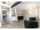 Inviting living room featuring a wet bar, cozy seating, and modern lighting at 6980 Fargo Trl, Littleton, CO 80125