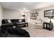 Cozy finished basement living area with comfortable seating, stylish decor, and plenty of space to relax at 6980 Fargo Trl, Littleton, CO 80125