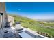 Enjoy outdoor living on this beautiful patio with mountain views, a grill, and comfortable seating at 6980 Fargo Trl, Littleton, CO 80125