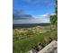 Expansive scenic view from the property overlooking lush greenery, a wooden fence, and a beautiful sky above at 6980 Fargo Trl, Littleton, CO 80125