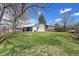 Expansive backyard showing a patio, grill, and generous green space, ideal for entertaining and outdoor living at 7240 S Cherry Dr, Centennial, CO 80122