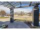 View of a cozy covered front porch with decorative flower pot and view of the neighborhood at 7240 S Cherry Dr, Centennial, CO 80122