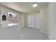 Laundry room with modern washer and dryer and gray tiling at 7240 S Cherry Dr, Centennial, CO 80122