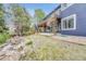 Expansive backyard with a relaxing pond and patio, perfect for outdoor enjoyment at 10233 Greatwood Ct, Highlands Ranch, CO 80126