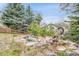 Landscaped backyard featuring a decorative pond and a serene atmosphere at 10233 Greatwood Ct, Highlands Ranch, CO 80126