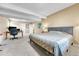 Spacious carpeted basement bedroom with a work-space, neutral walls, and a comfortable bed at 10233 Greatwood Ct, Highlands Ranch, CO 80126