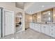 Bright bathroom with double vanity, granite countertops, framed mirrors and tile flooring at 10233 Greatwood Ct, Highlands Ranch, CO 80126