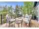 Relaxing deck area with comfortable seating around a fire pit, perfect for outdoor gatherings and enjoying the views at 10233 Greatwood Ct, Highlands Ranch, CO 80126