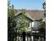 Inviting home featuring a tile roof, private balcony, and scenic mountain views in a well-maintained community at 10233 Greatwood Ct, Highlands Ranch, CO 80126