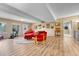 Basement Gathering room features exposed beams and walks out to the exterior at 10233 Greatwood Ct, Highlands Ranch, CO 80126