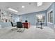 Bright office space with built-in bookshelves, neutral carpet, and large windows at 10233 Greatwood Ct, Highlands Ranch, CO 80126