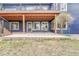 Cozy, covered patio with outdoor seating, providing an ideal space for relaxation and entertaining at 10233 Greatwood Ct, Highlands Ranch, CO 80126